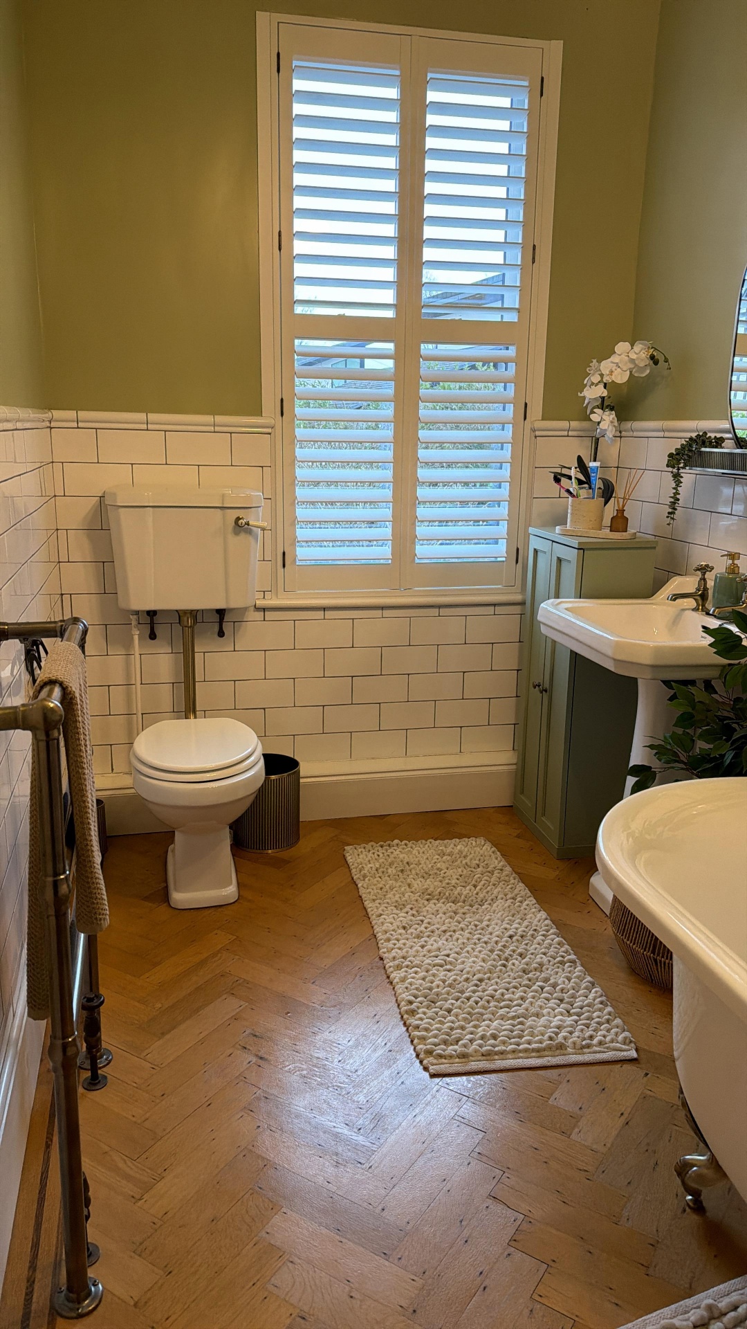 White plantation shutters in a period bathroom
