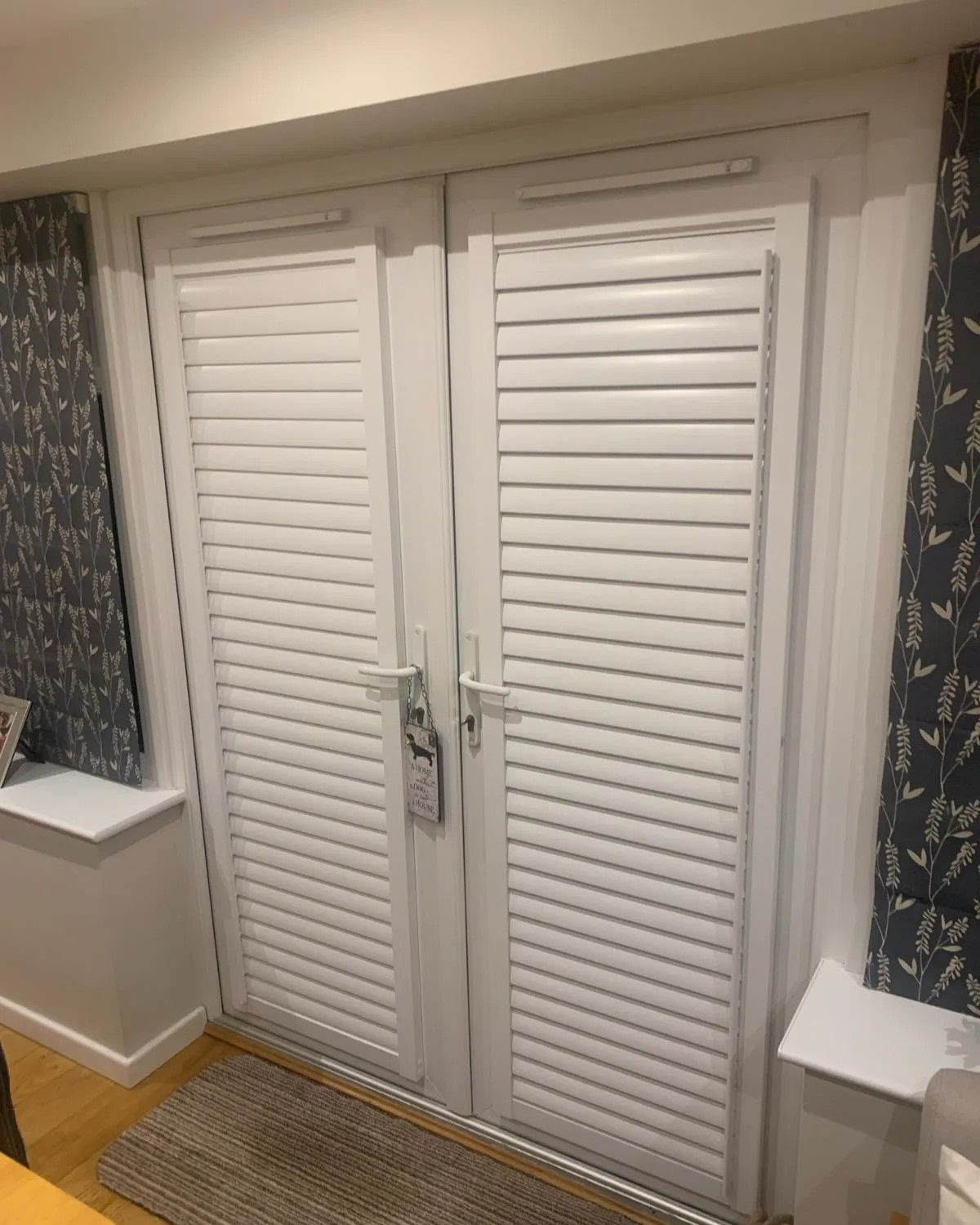 Perfect fit white plantation shutters on French doors