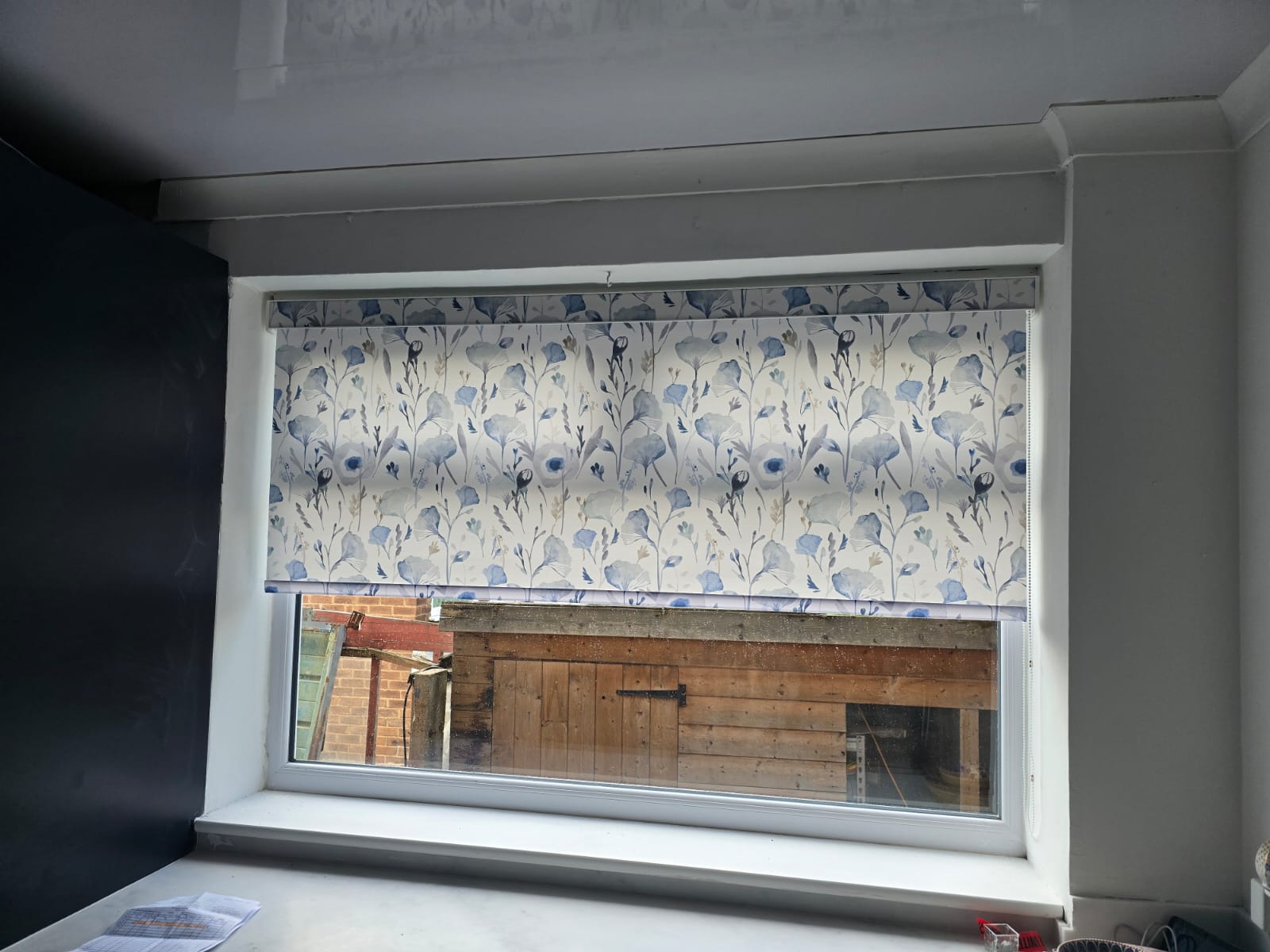 Patterned floral roller blind