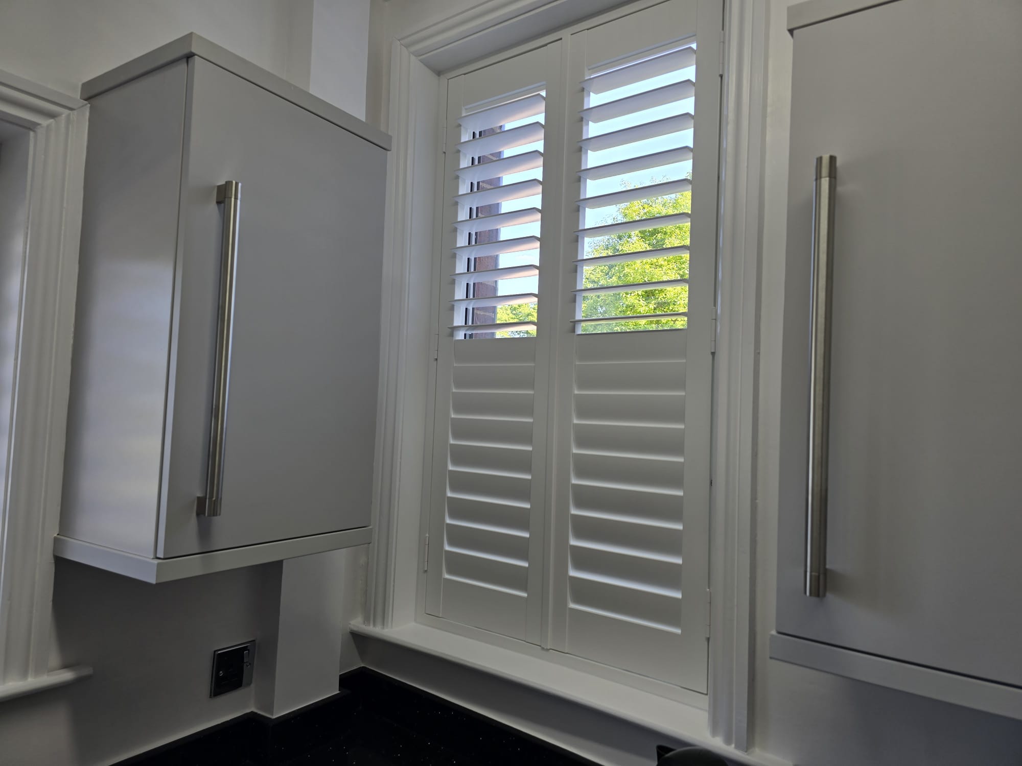 Small window shutter fitted in a Manchester home