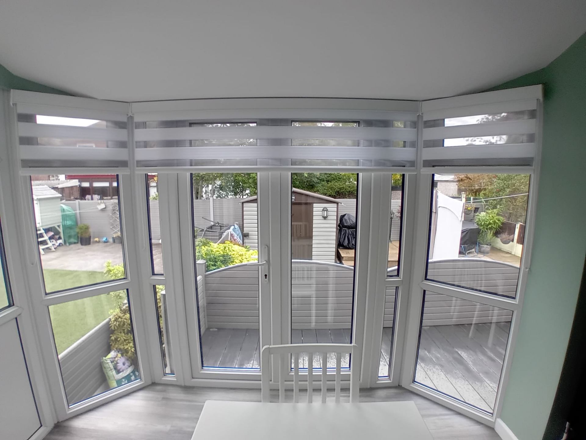 White vision blinds across a conservatory bay